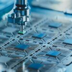 Close-up_of_Silicon_Die_are_being_Extracted_from_Semiconductor_Wafer_and_Attached_to_Substrate_by_Pick_and_Place_Machine._Computer_Chip_Manufacturing_at_Fab._Semiconductor_Packaging_Process.;_Shutterstock_ID_2262331365;_kostenstelle:_-;_job:_-;_sonstiges:_-