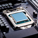 Blank_CPU_lid_top,_socket_cover_view_angle_processor_placed_and_locked_in_the_socket_on_a_brand_new_modern_high_end_gaming_productivity_motherboard_macro_PC_components_assembly_process_concept_closeup